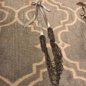 Silver beaded necklace on gray satin ribbon